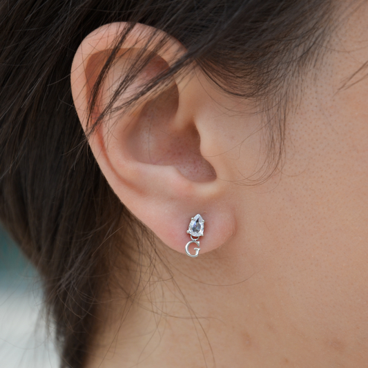 BRINCOS GUESS STUDS PARTY AÇO PRATEADO 'JUBE02151JWRHT-U'